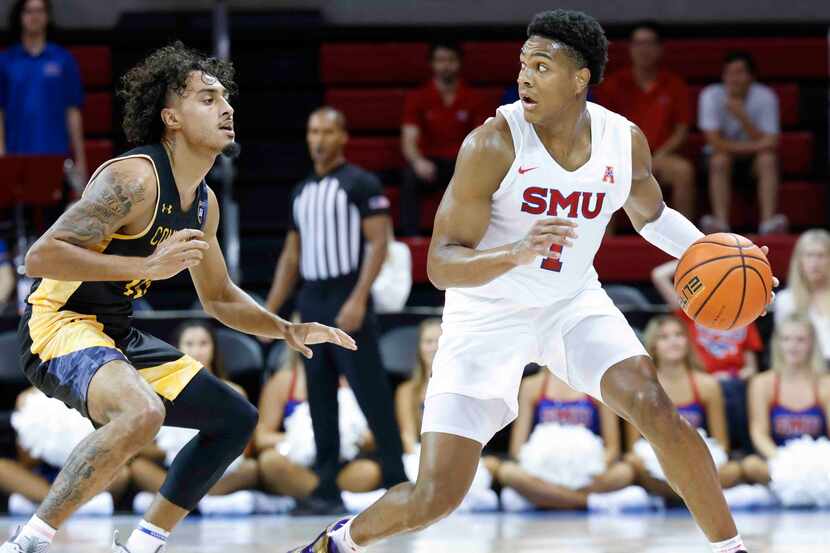 Southern Methodist guard Zhuric Phelps (1), right, looks to pass past Texas A&M-Comm’s...