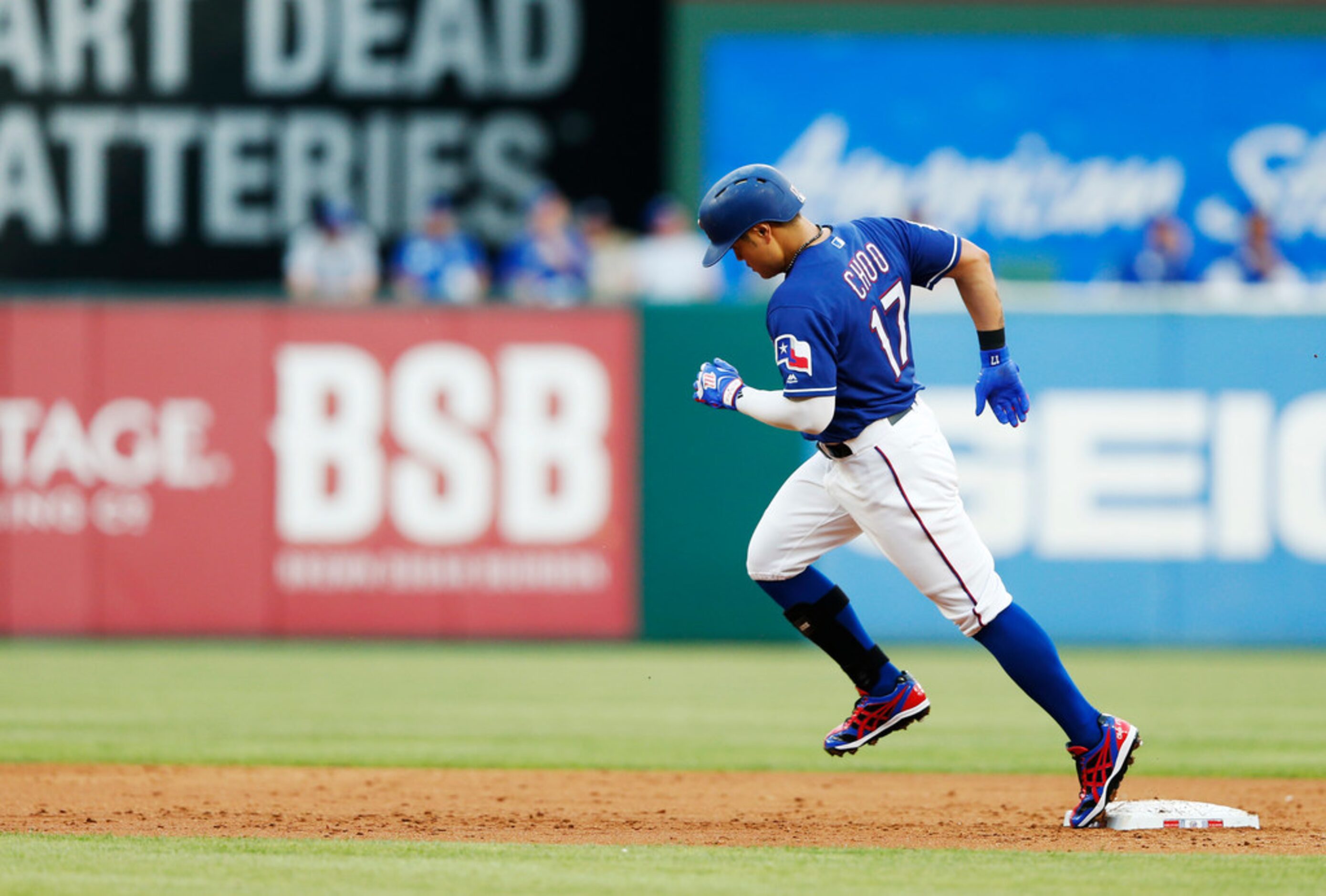 Texas Rangers right fielder Shin-Soo Choo (17) rounds the bases after hitting a home run in...