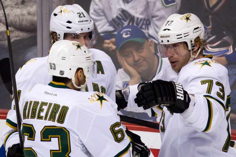 Dallas' Mike Ribeiro, Loui Eriksson (21) and Michael Ryder celebrate Eriksson's goal in the...