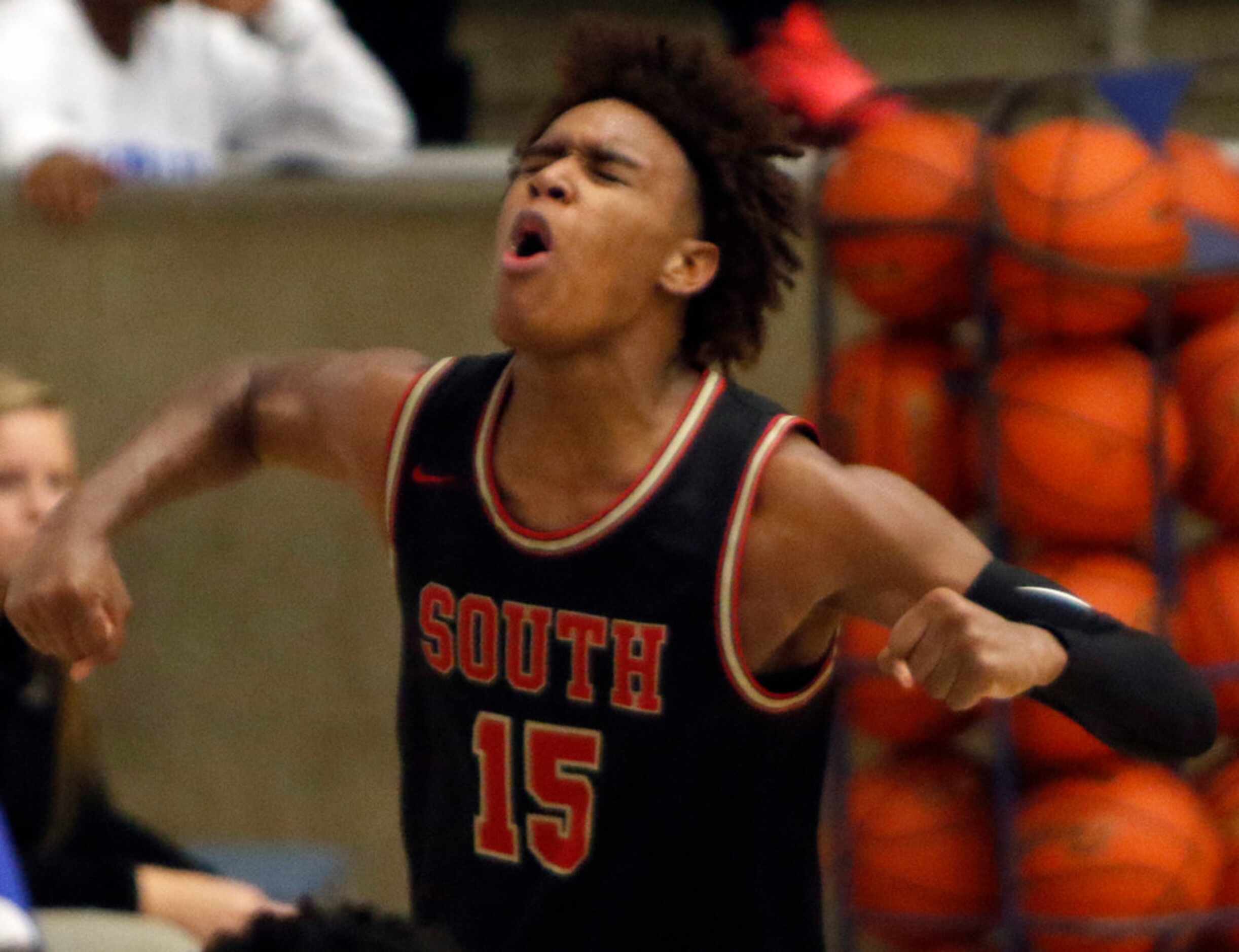 South Grand Prairie's Christian Turner (15) lets out a yell after blocking a shot by Grand...