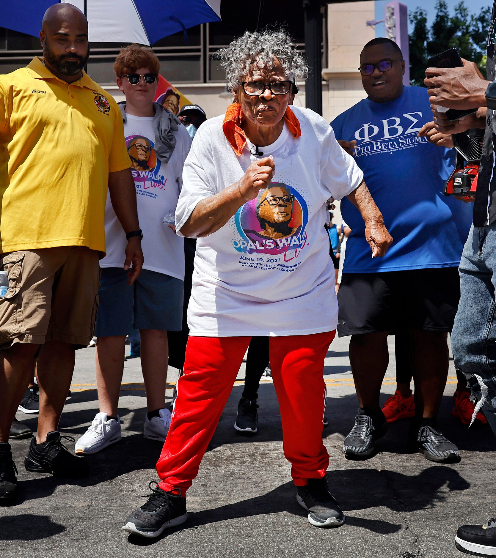 During her walk through downtown Fort Worth, Opal Lee (center) stopped in the middle of...