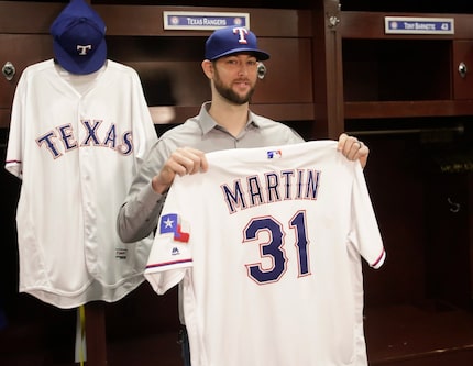 Free agent right-handed pitcher Chris Martin talks with area media after signing to a...