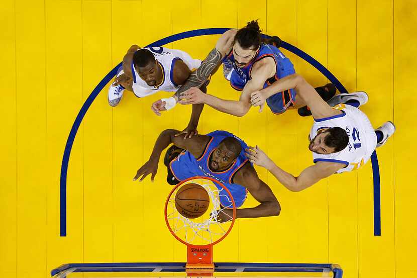 OAKLAND, CA - MAY 18:  (L-R) Harrison Barnes #40 of the Golden State Warriors, Serge Ibaka...