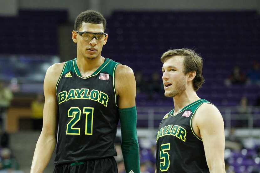 Baylor center Isaiah Austin (21) and guard Brady Heslip (5) on the court during the second...