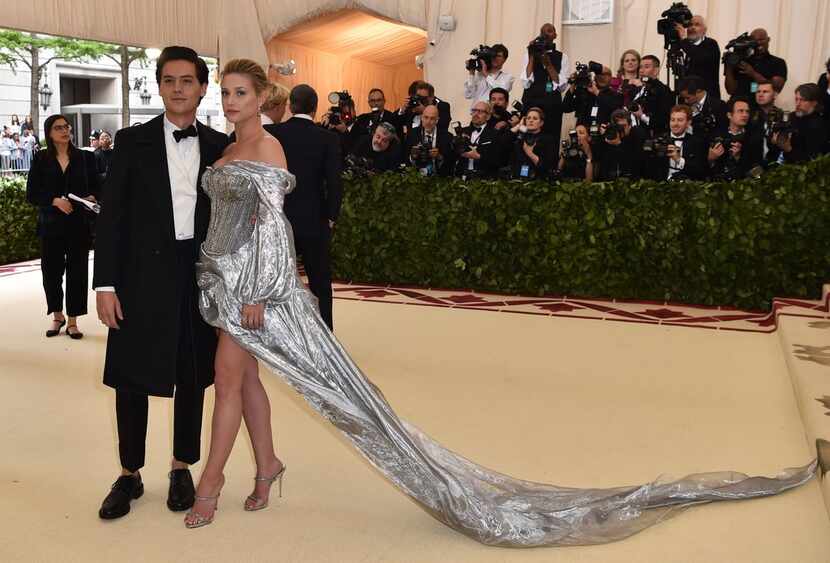 Cole Sprouse and Lili Reinhart arrive for the 2018 Met Gala on May 7, 2018, at the...