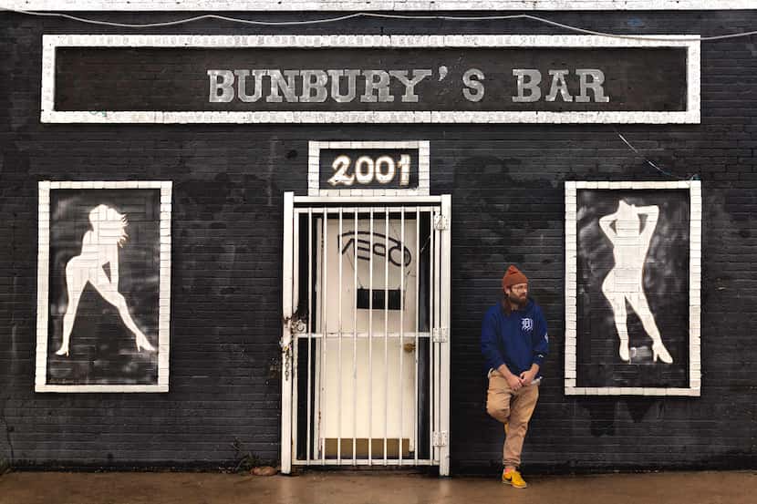 Dallas-based musician Donovan Jones stands in front of Bunbury's Bar. His song entitled...