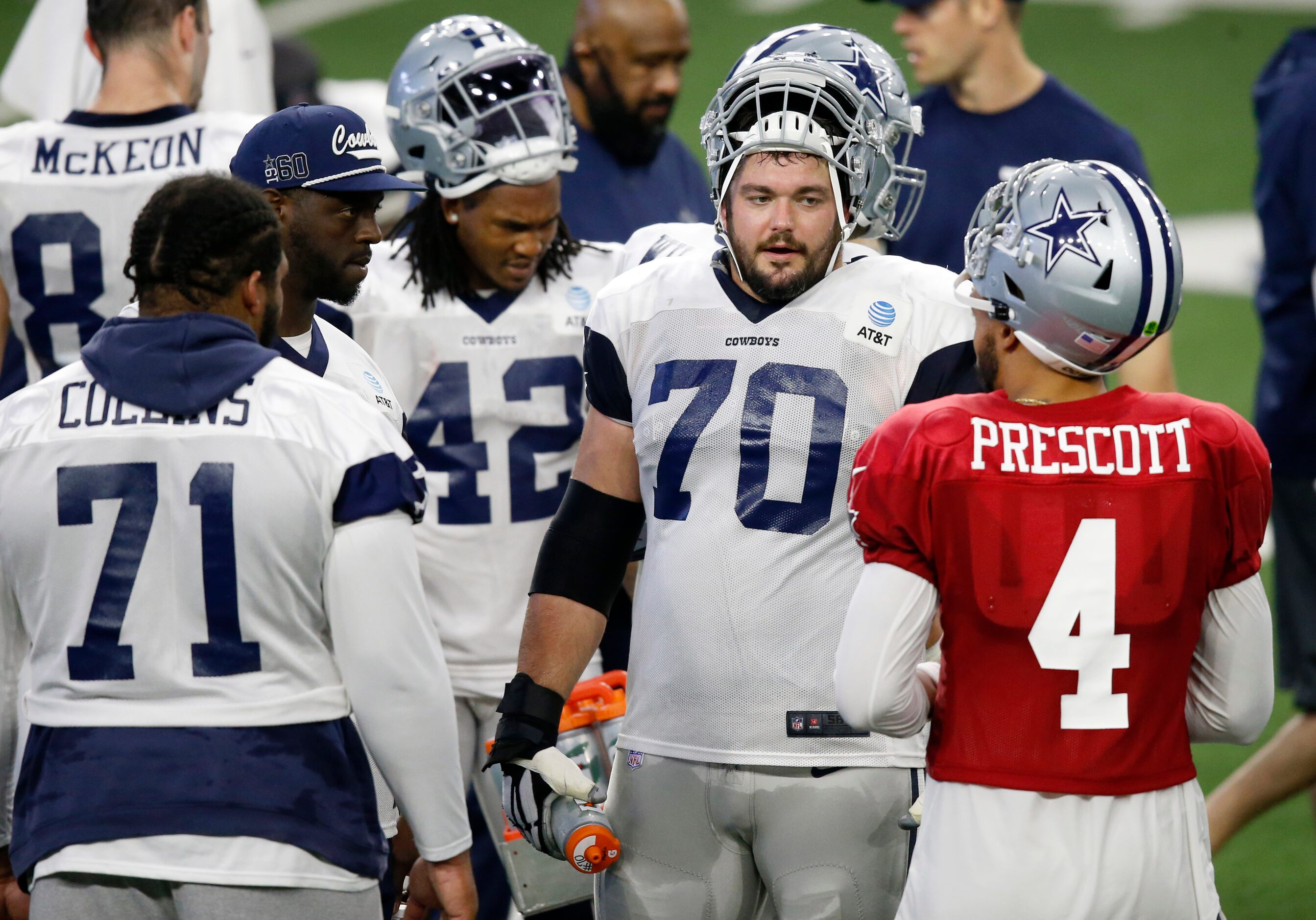 Dallas Cowboys quarterback Dak Prescott (4) talks with Dallas Cowboys guard Zack Martin...