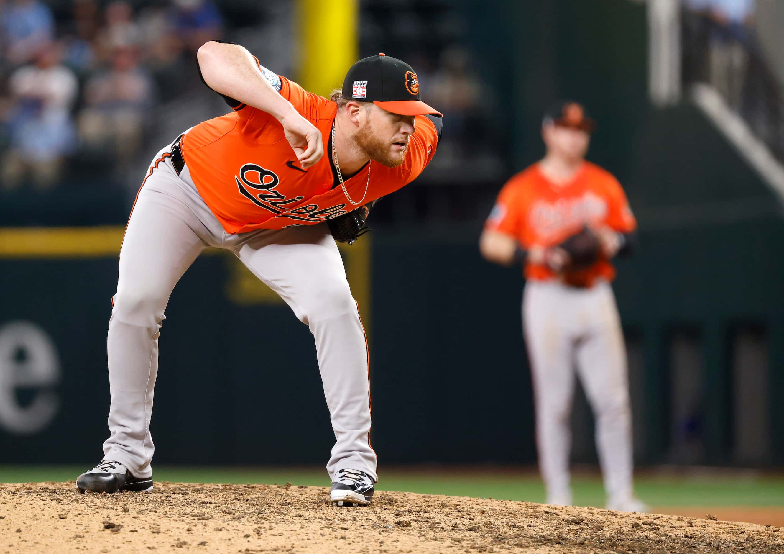 Baltimore Orioles pitcher Craig Kimbrel (46) looks in for a sign as readies to pitch against...