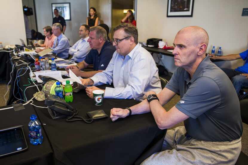 Dallas Mavericks general manager Donnie Nelson (second from right) and head coach Rick...