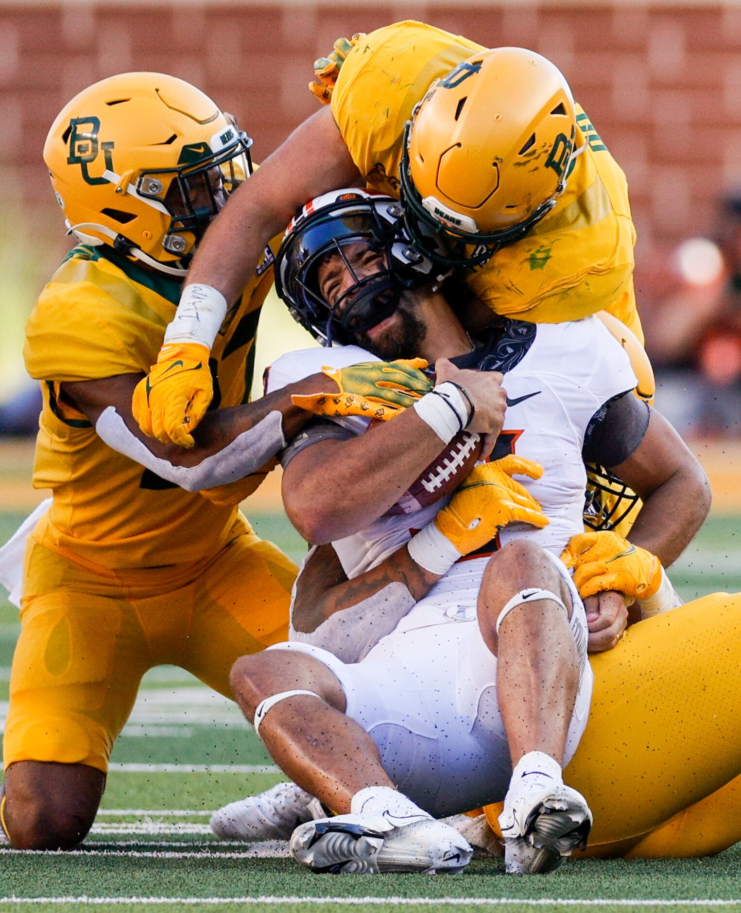 Baylor cornerback Tevin Williams III (left), linebacker Dillon Doyle (top right) and Baylor...