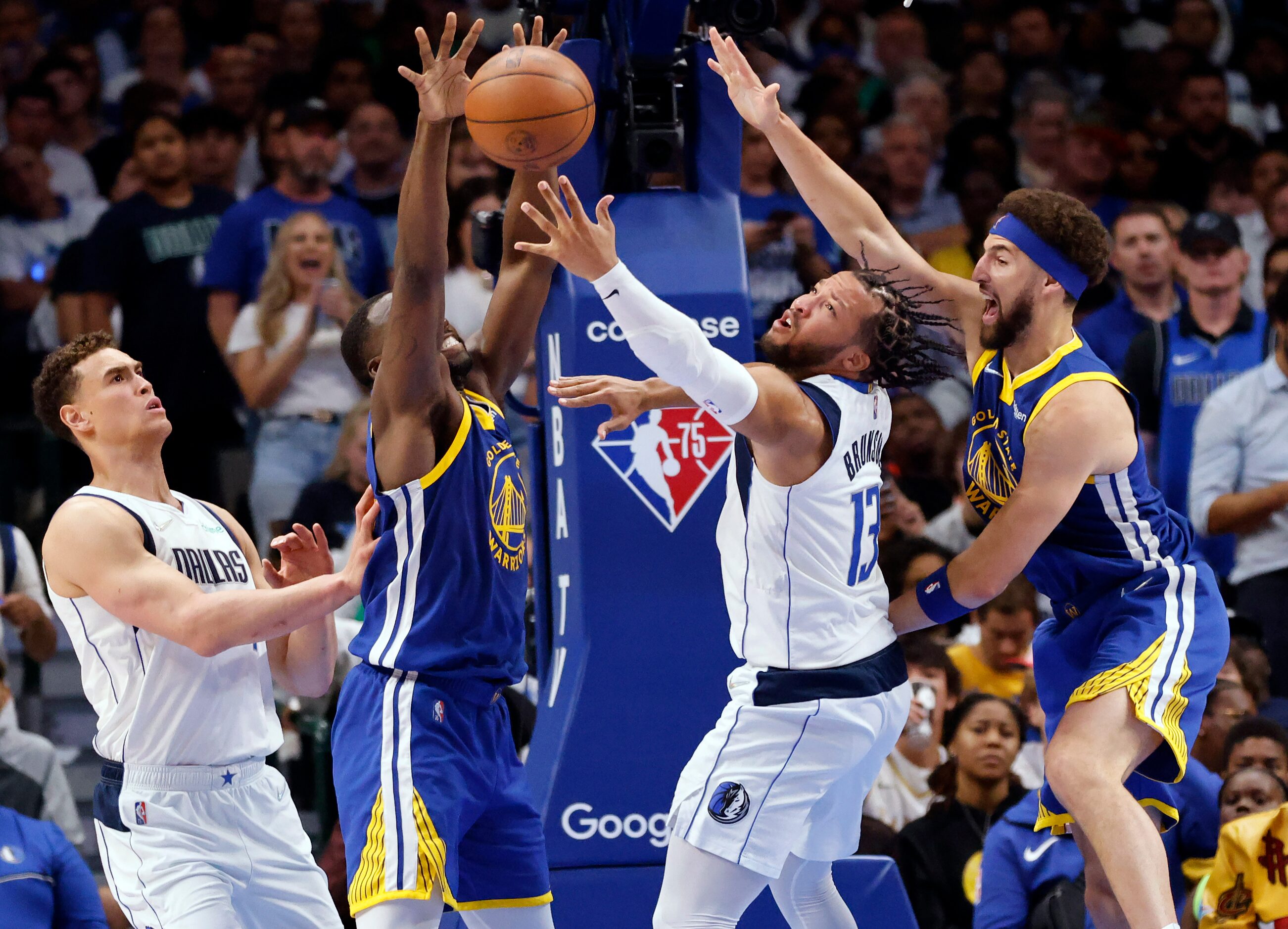 Dallas Mavericks guard Jalen Brunson (13) puts up a shot under the basket against Golden...