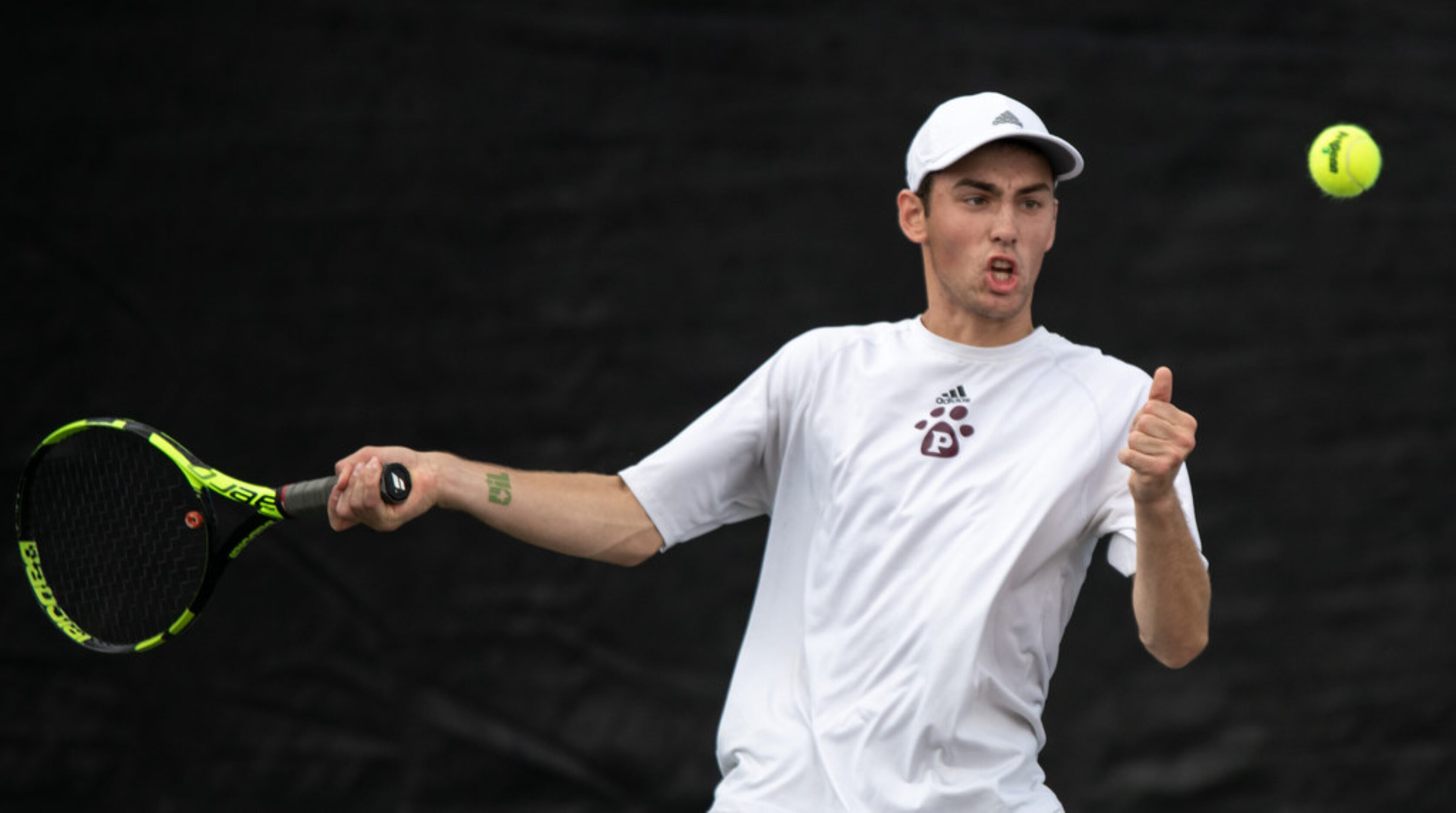 Plano's Edward Shteyn returns the ball in a doubles match with teammate Herman Aguirre in a...