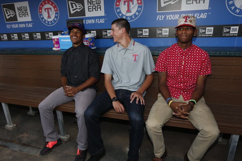 Texas Rangers draft picks (left to right) Josh Morgan, Brett Martin and Tiquan Forbes, talk...