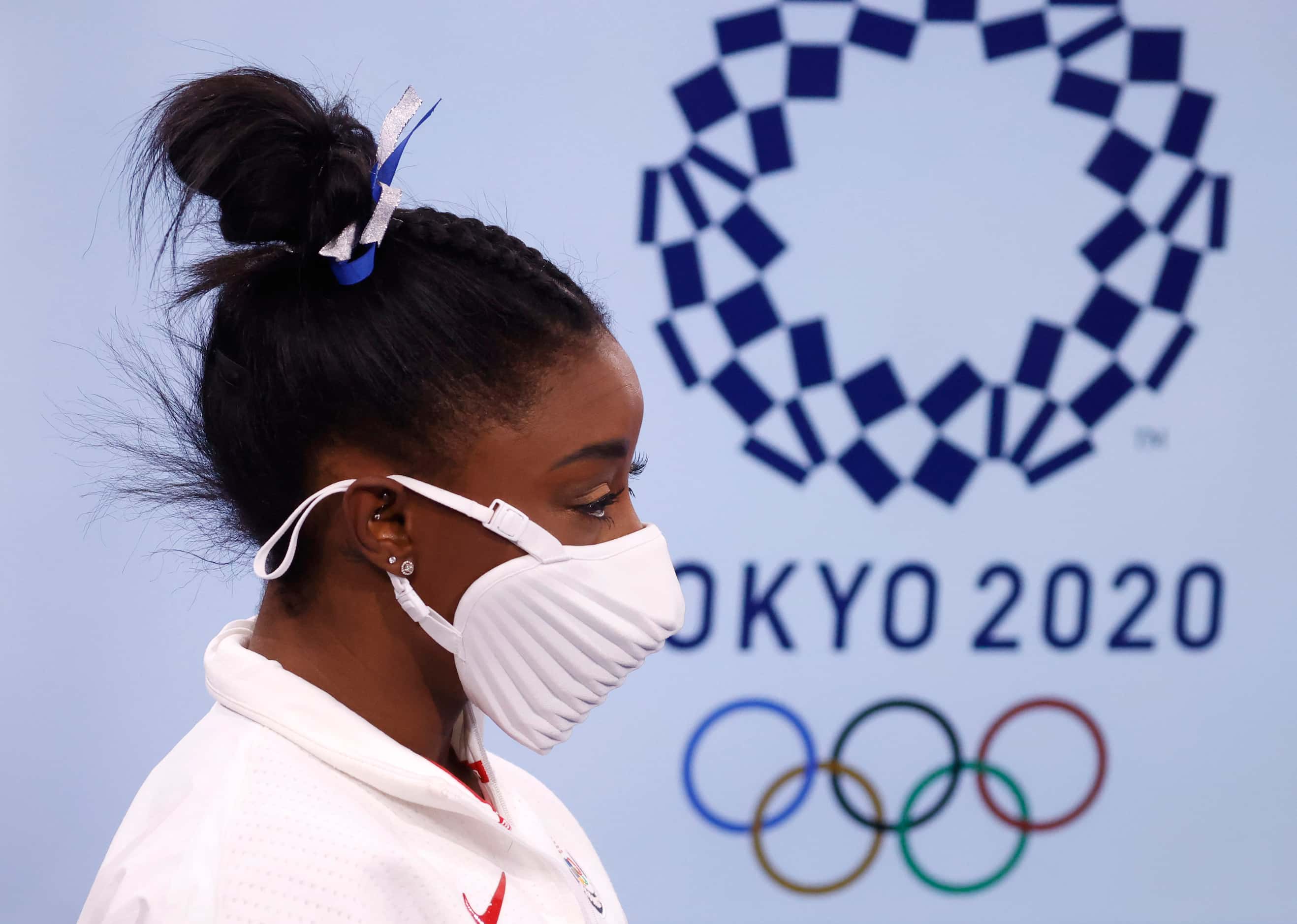 USA’s Simone Biles makes her way to the medal ceremony after winning a bronze medal in the...
