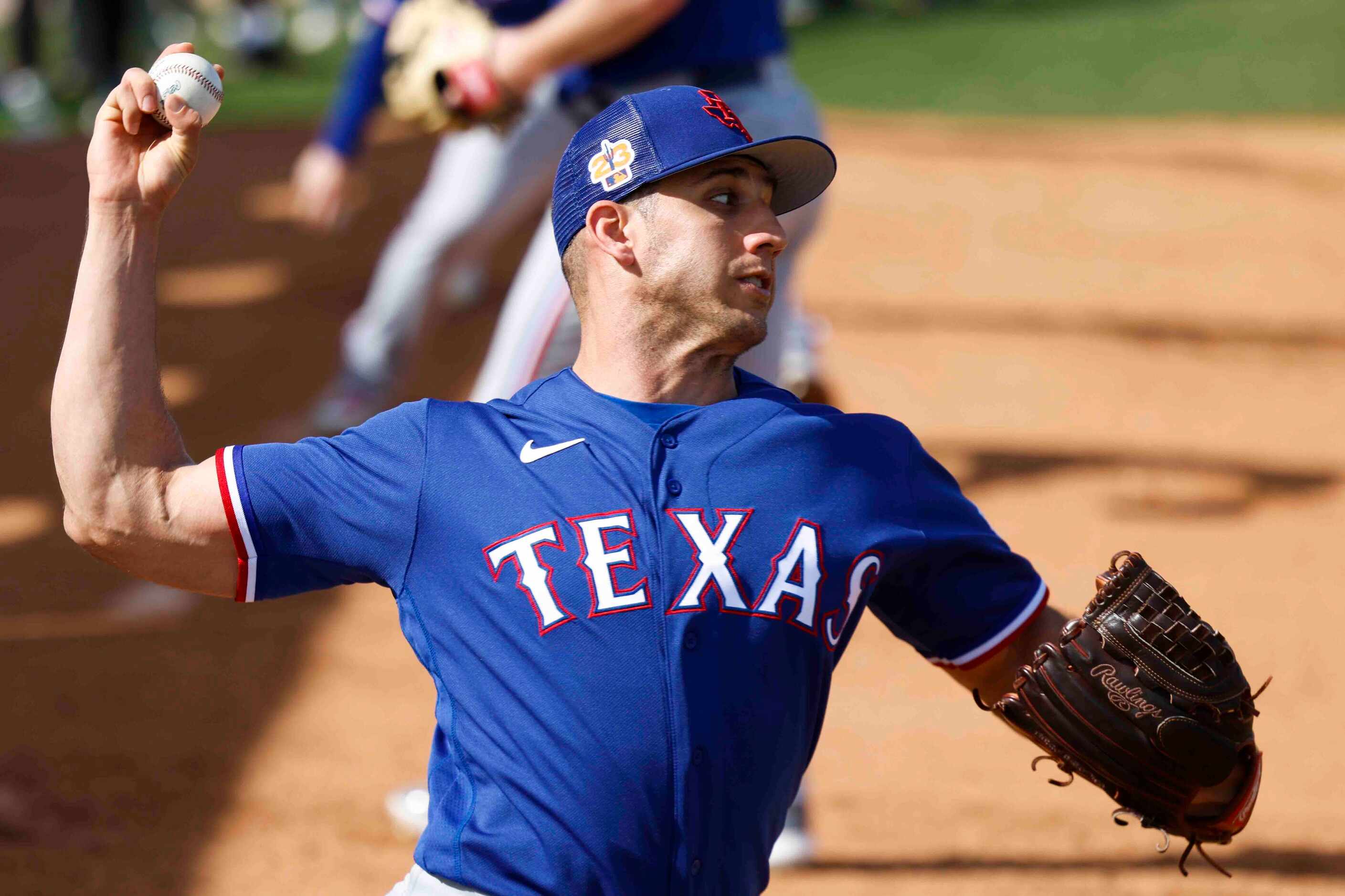Texas Rangers pitcher Jacob Barnes throws a pitch during a spring training workout at the...
