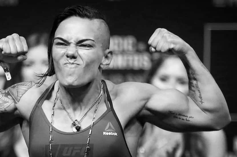 Women's Strawweight fighter Jessica Andrade strikes a pose on the scale as she weighs-in for...
