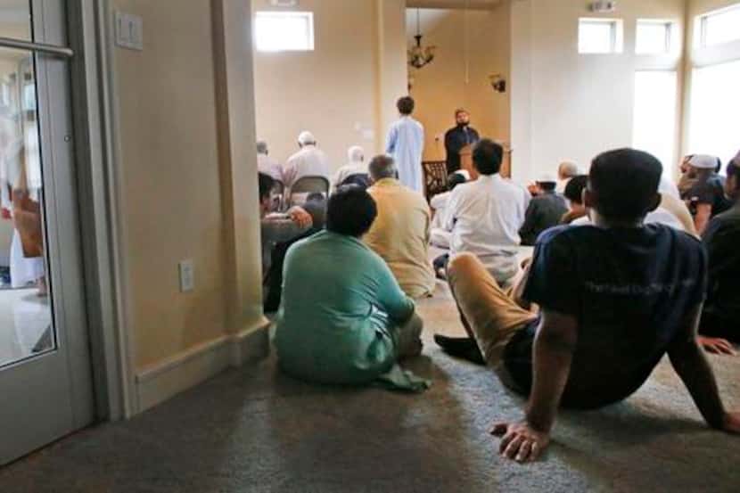 
A Muslim boy made his way into a gathering for teaching and prayers at the Islamic...