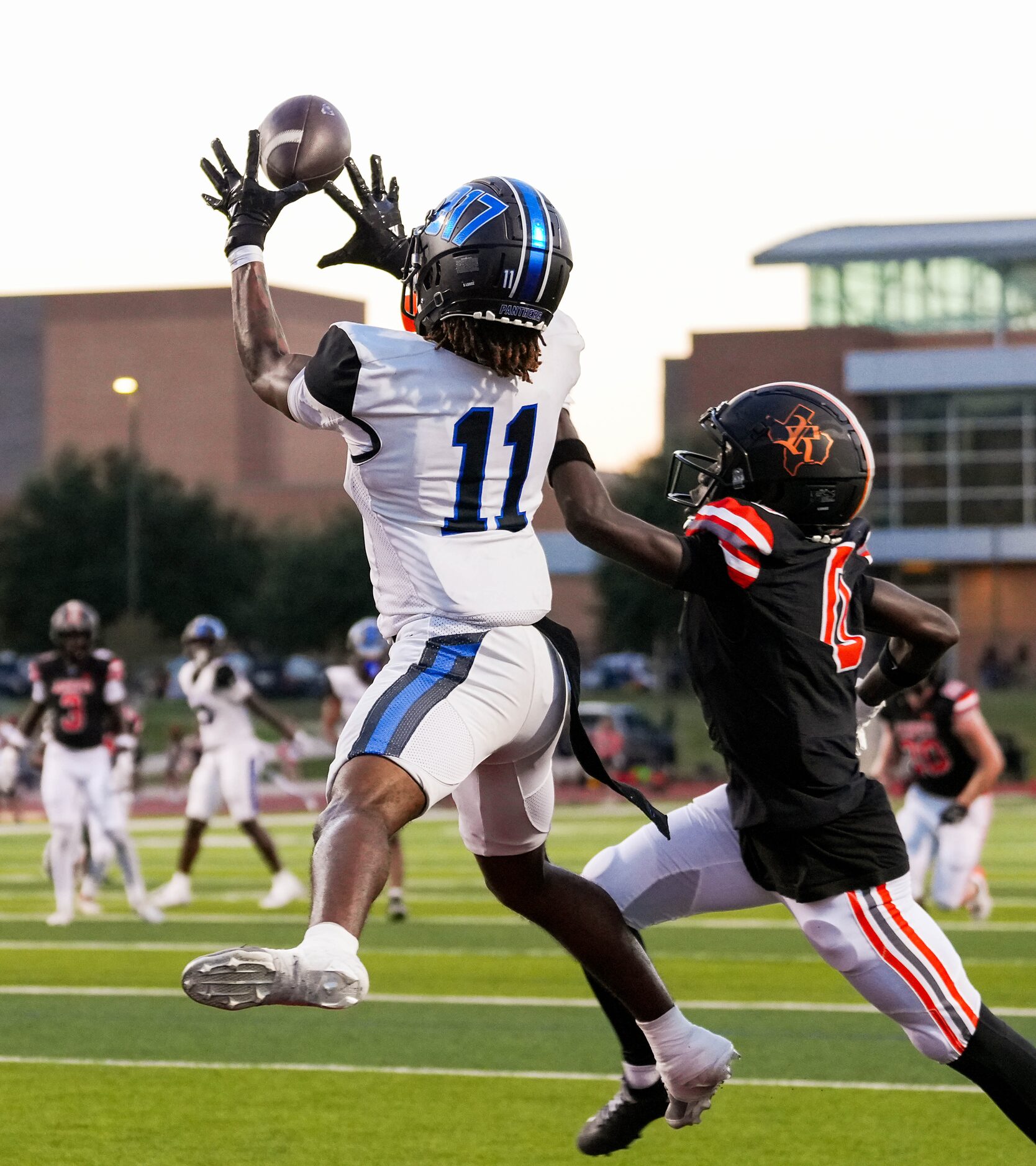 North Crowley wide receiver Cam Hunter (11) catches a touchdown pass as Rockwall defensive...