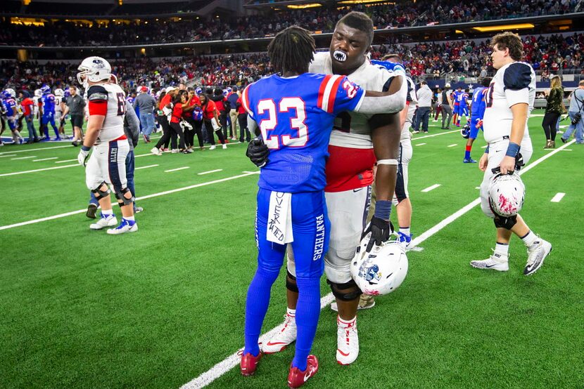 Duncanville wide receiver Marquez Beason (23) consoles Allen offensive lineman EJ Ndoma-Ogar...