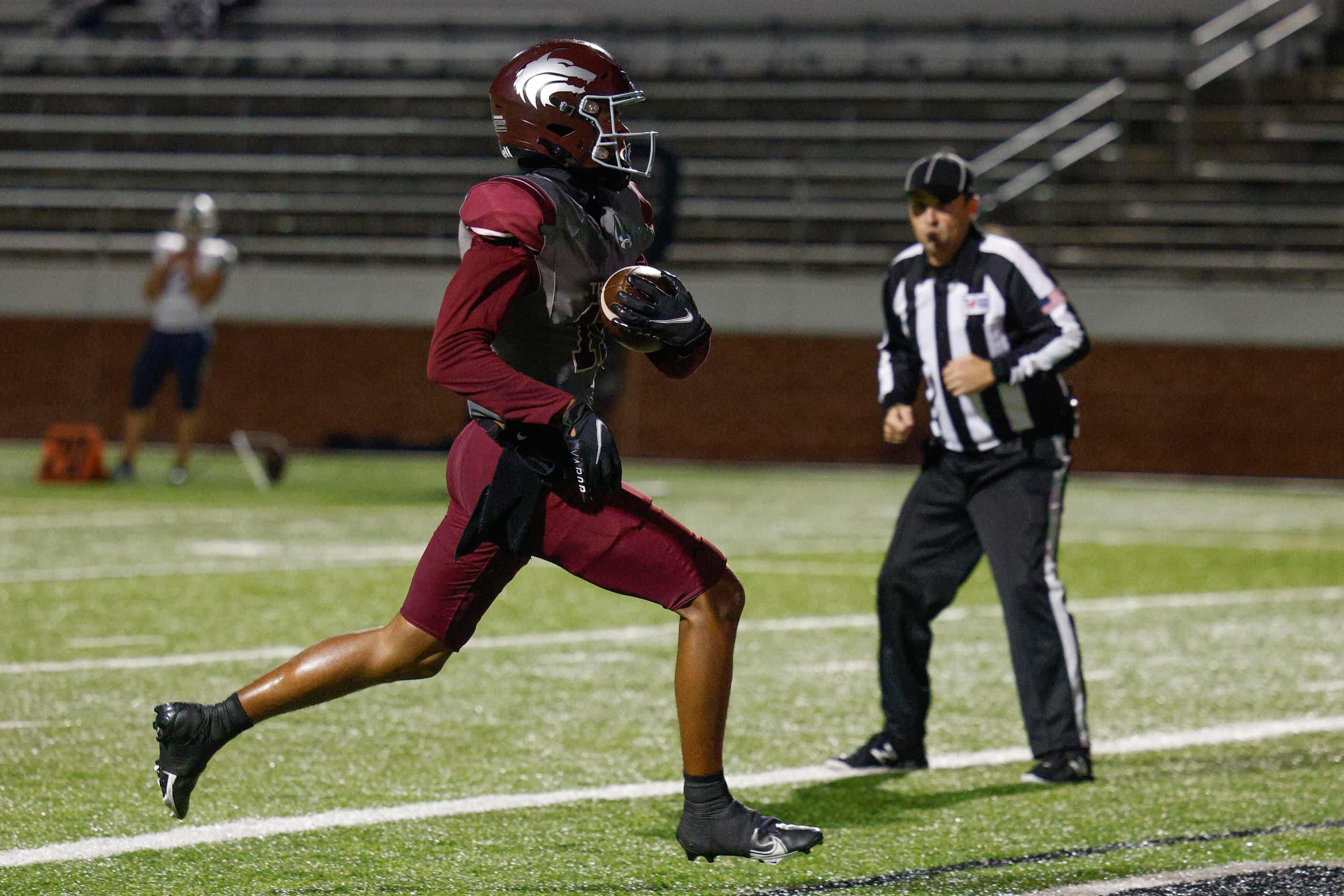 Mansfield Timberview wide receiver Titus Evans (15) scores a touchdown after a catch during...
