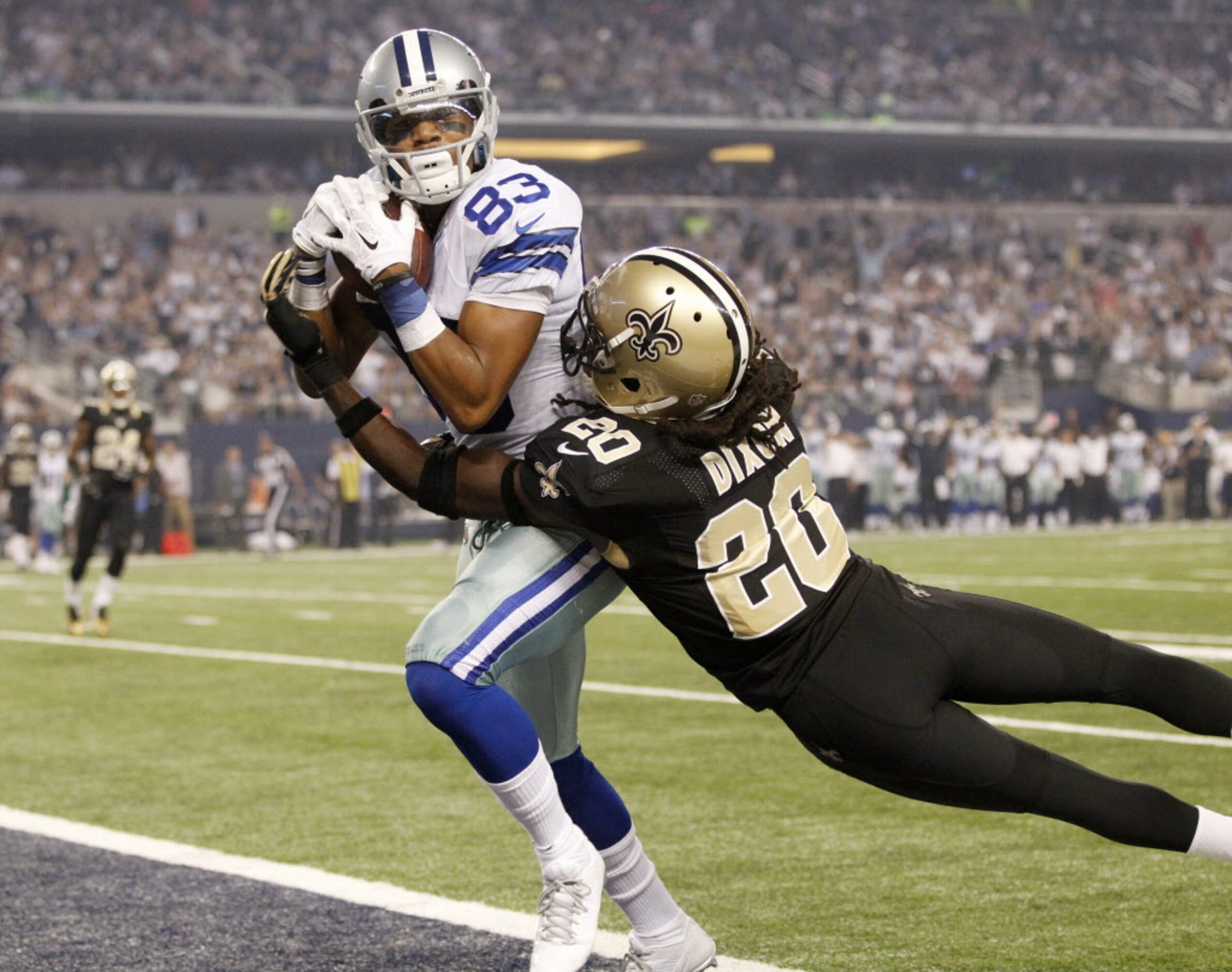 Dallas Cowboys wide receiver Terrance Williams (83) scores a touchdown after the catch as...