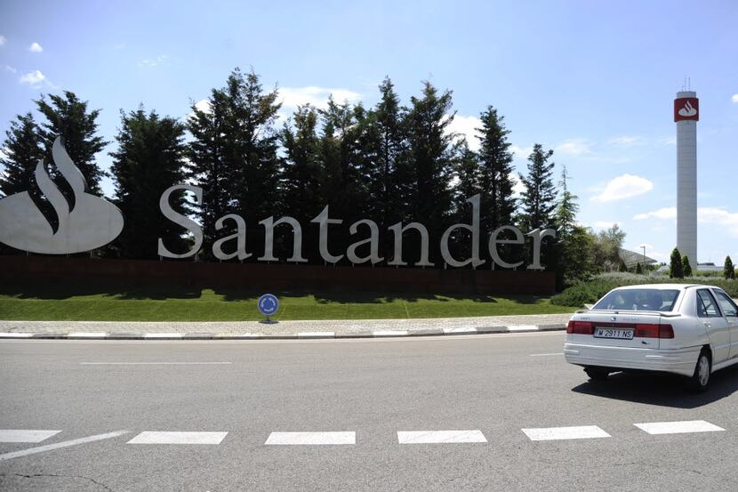 A car drives past Santander Bank's logo at the Santander Bank's Financial City in Boadilla...