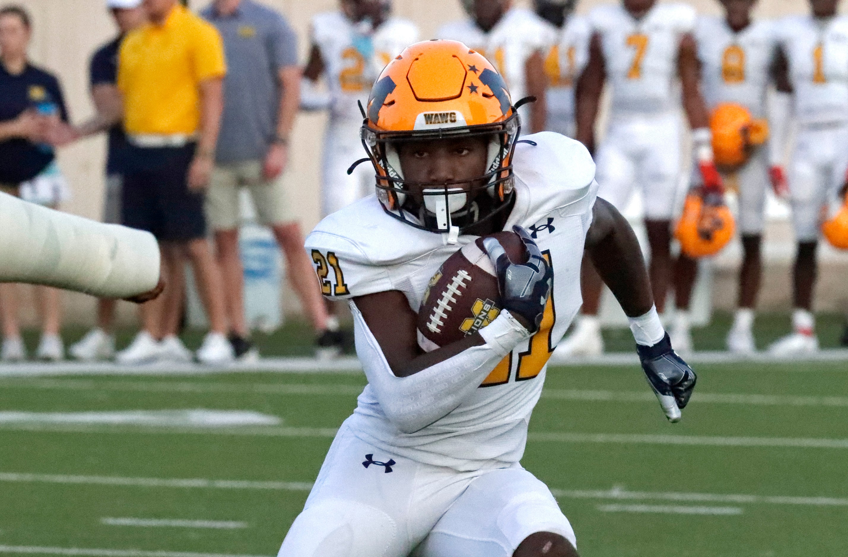 McKinney High School running back Ja'Tavious Greer (21) carries the ball during the first...