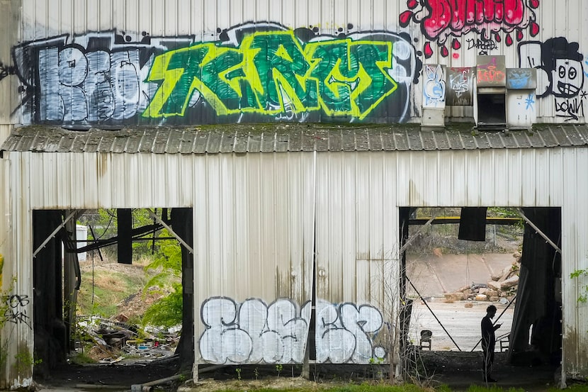 Graffiti covers a former plant at 240 Singleton in West Dallas on Tuesday, March 21, 2023. 