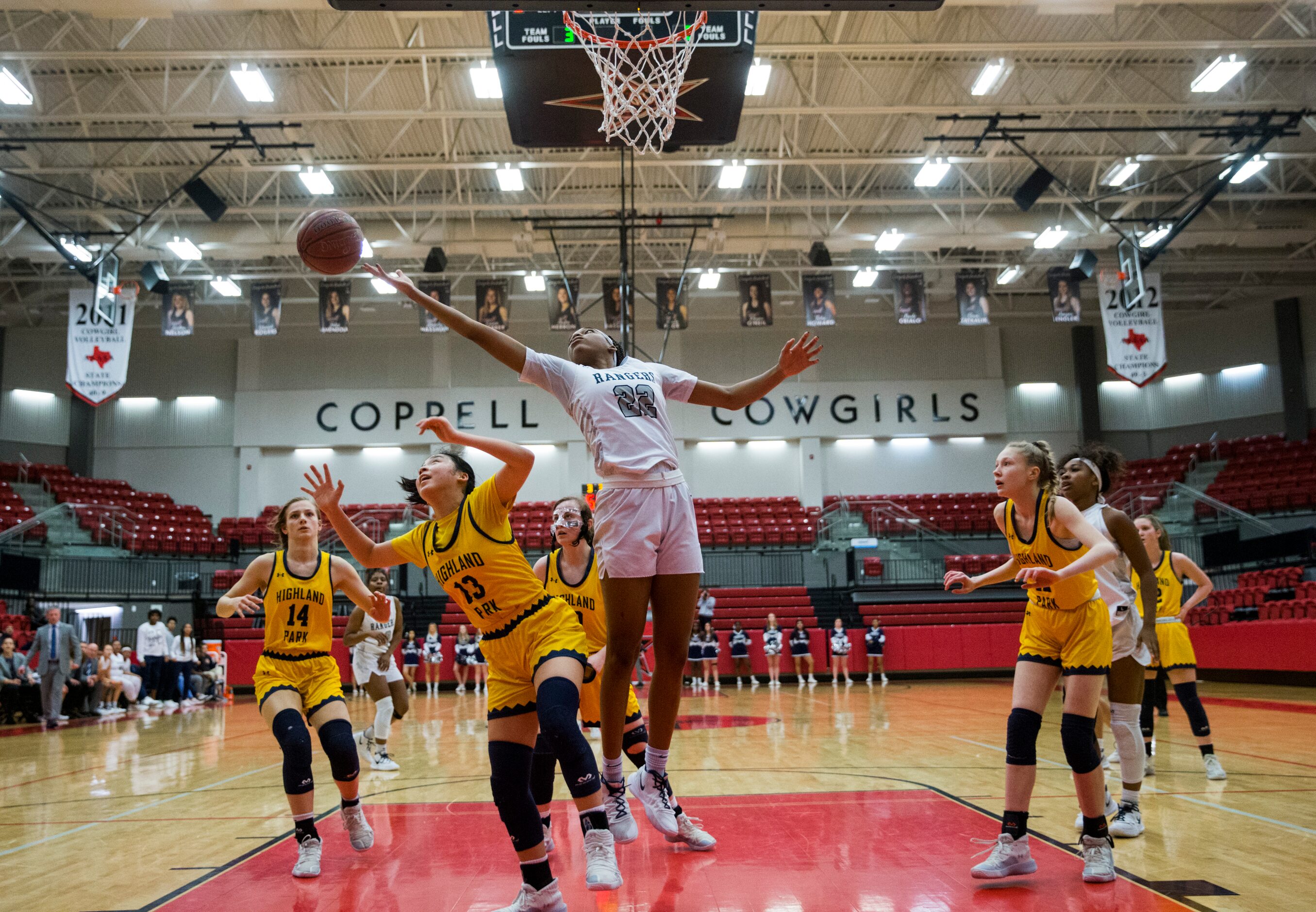 Frisco Lone Star forward Victoria Gooden (22) and Highland Park guard Vivian Jinn (13) reach...