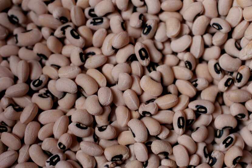 A detail of a barrel of black-eyed peas