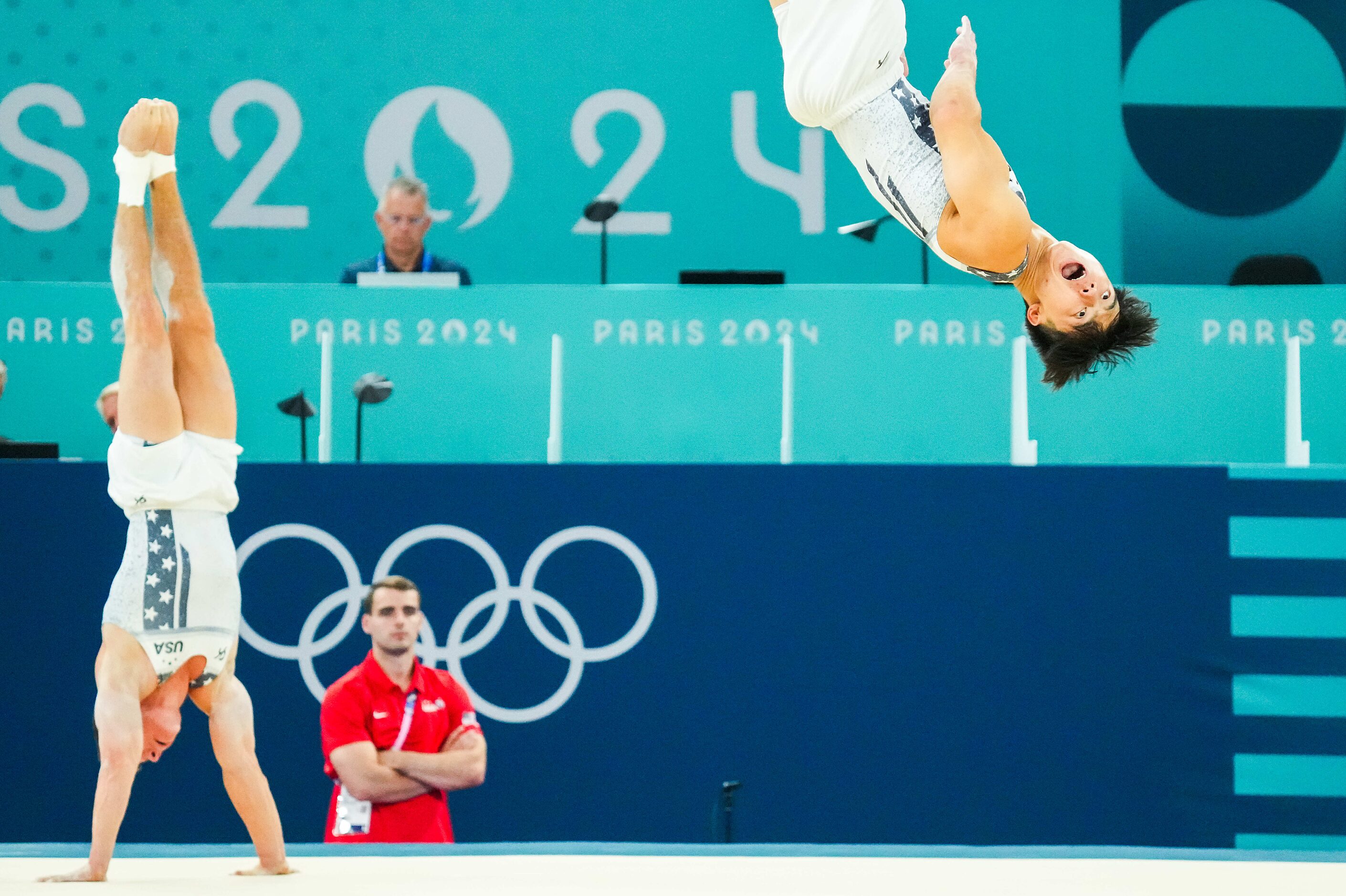 Asher Hong of the United States (right) and teammate Brody Malone work on the floor during...