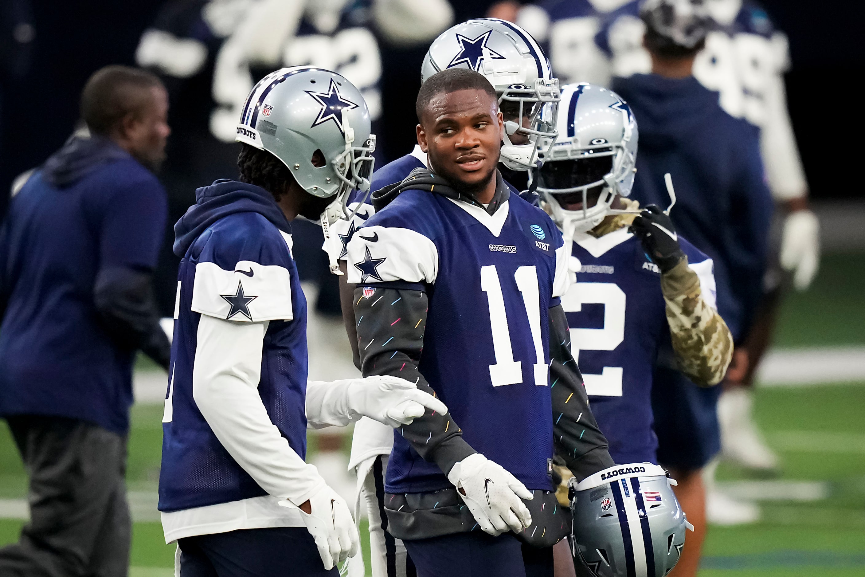 Dallas Cowboys linebacker Micah Parsons (11) talks with cornerback Trevon Diggs (7) during...