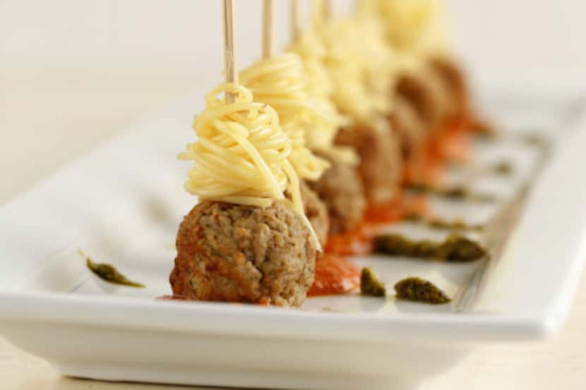 SPAGHETTI AND MEATBALLS: Working with 3 strands, twirl pasta around a skewer and skewer into...