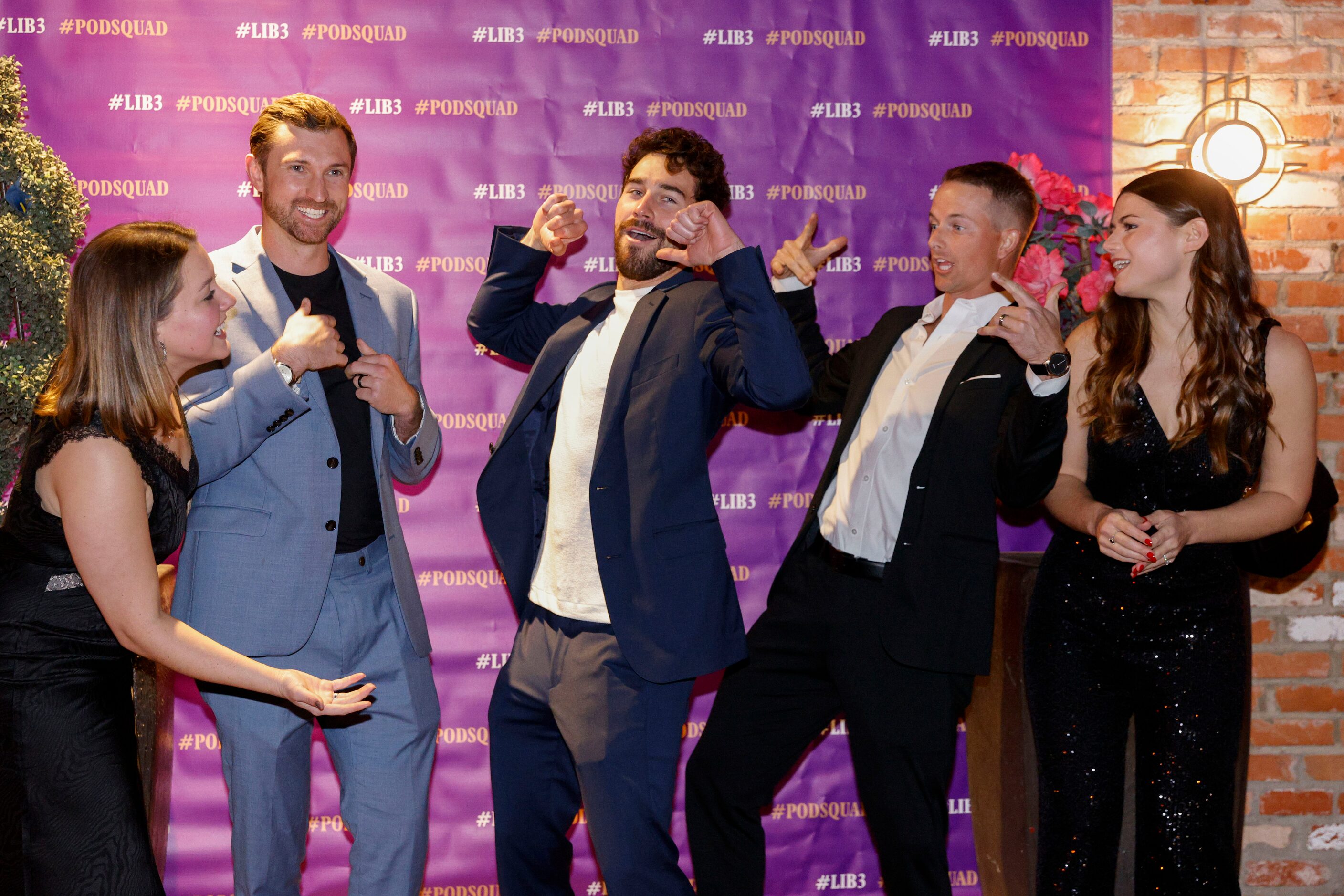 Love is Blind cast member Cole Barnett (center) poses for a photo with friends during a...