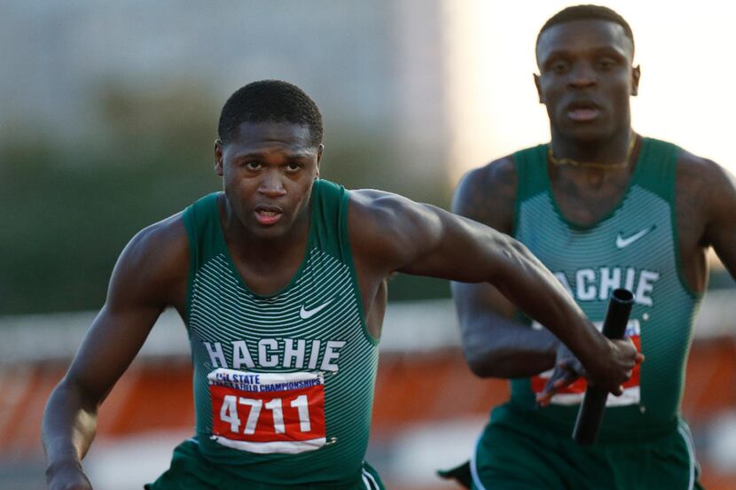 Waxahachie's De'Veon Sargent (4711) takes the baton from Jalen Reagor (4709) during the...