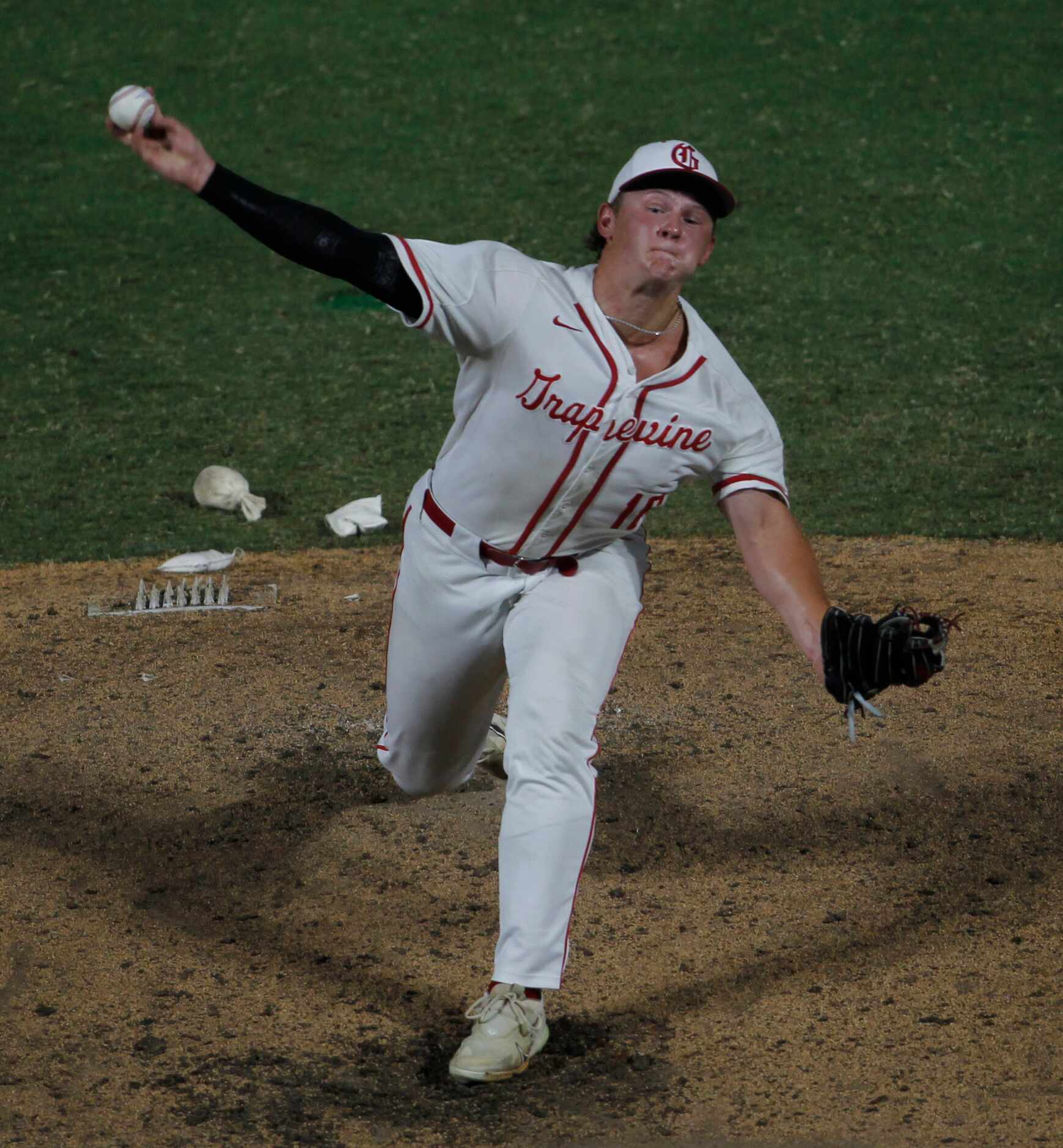 Grapevine pitcher Luke Schreyer (16) delivers a pitch to a Leander Rouse batter during the...