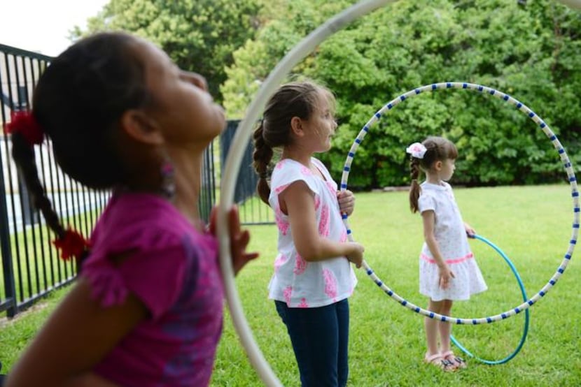 
Sophia Latham, 7, (middle) plays during summer camp at River of Life.
