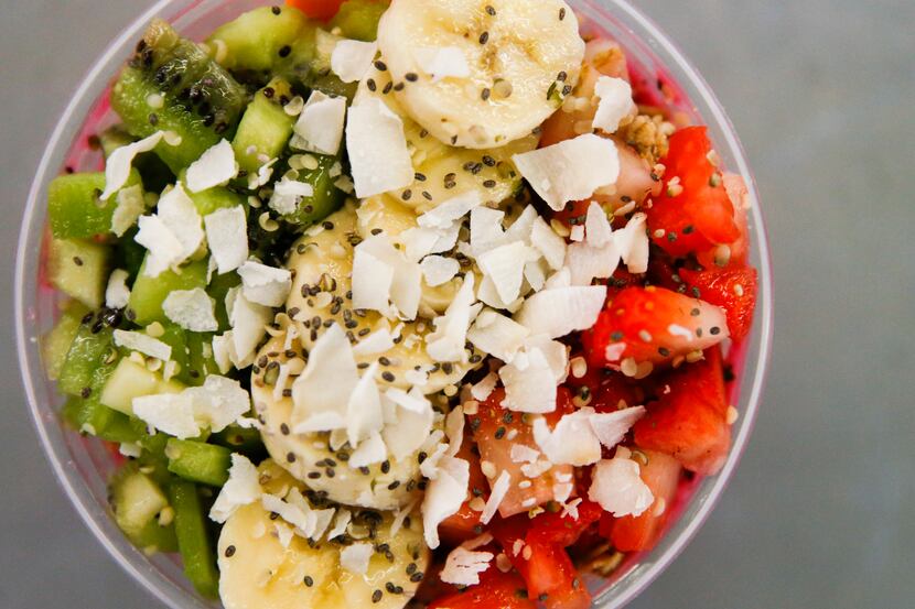 James McGee prepares a smoothie bowl at Peace Love Eatz in Grow DeSoto Marketplace on...