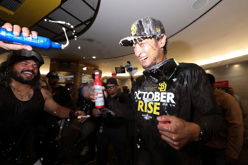 San Diego Padres' Yu Darvish, right, celebrates with Jorge Alfaro following a baseball game...