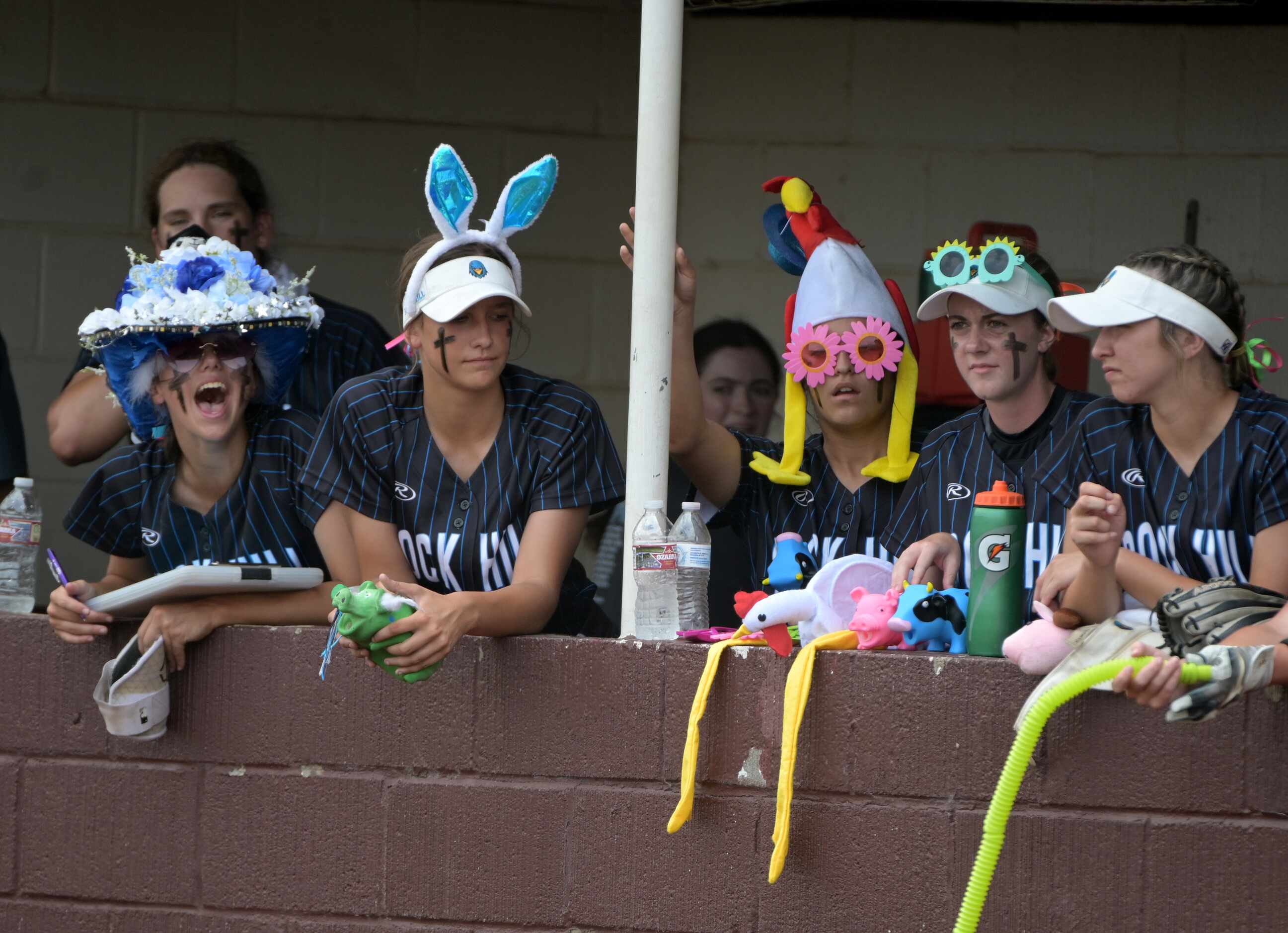 Prosper Rock Hill's players watch play from the dugout during game 3 of a Class 5A Region II...