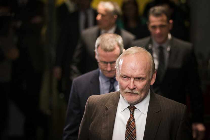 Dallas Stars head coach Lindy Ruff heads to the bench before facing the Calgary Flames in an...