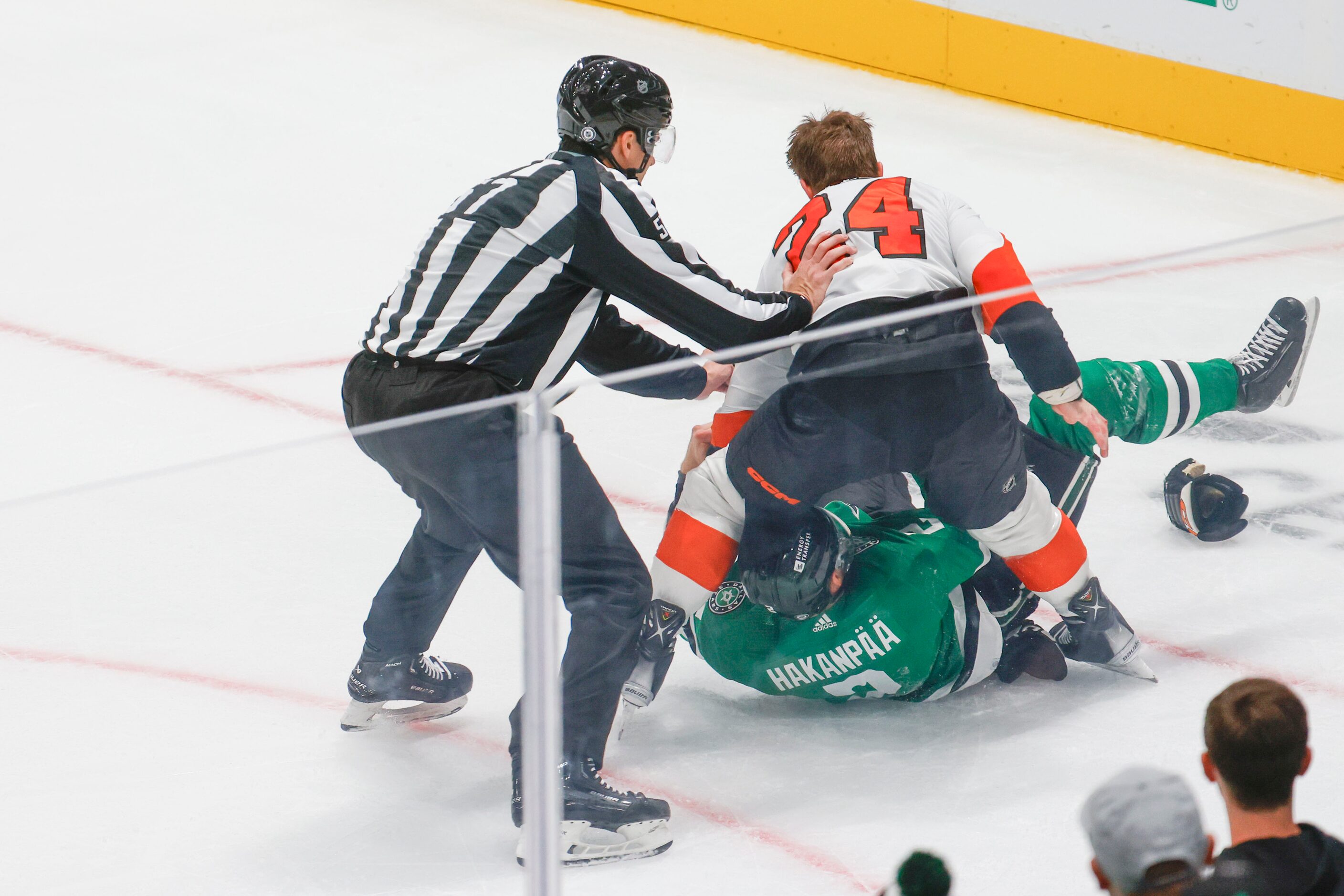 Philadelphia Flyers defenseman Nick Seeler (top) engage in a fight with Dallas Stars...