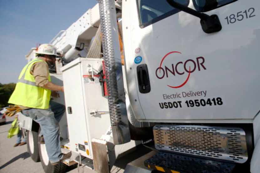  Oncor's Brandon Sowards, apprentice 6 puts tools back up in Grand Prairie on Monday,...