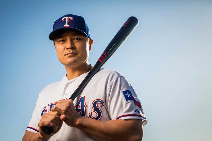 Texas Rangers outfielder Shin-Soo Choo poses for a photo during Spring Training picture day...