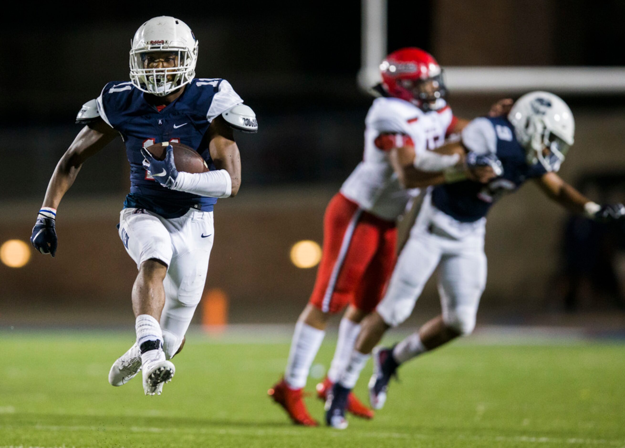 Allen running back Jordan Johnson (11) runs the ball during the fourth quarter of a high...