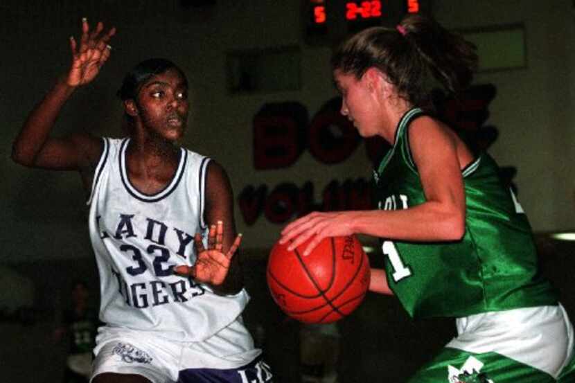 New Southlake Carroll girls basketball coach Robyn Anders McCoart (right) is pictured when...