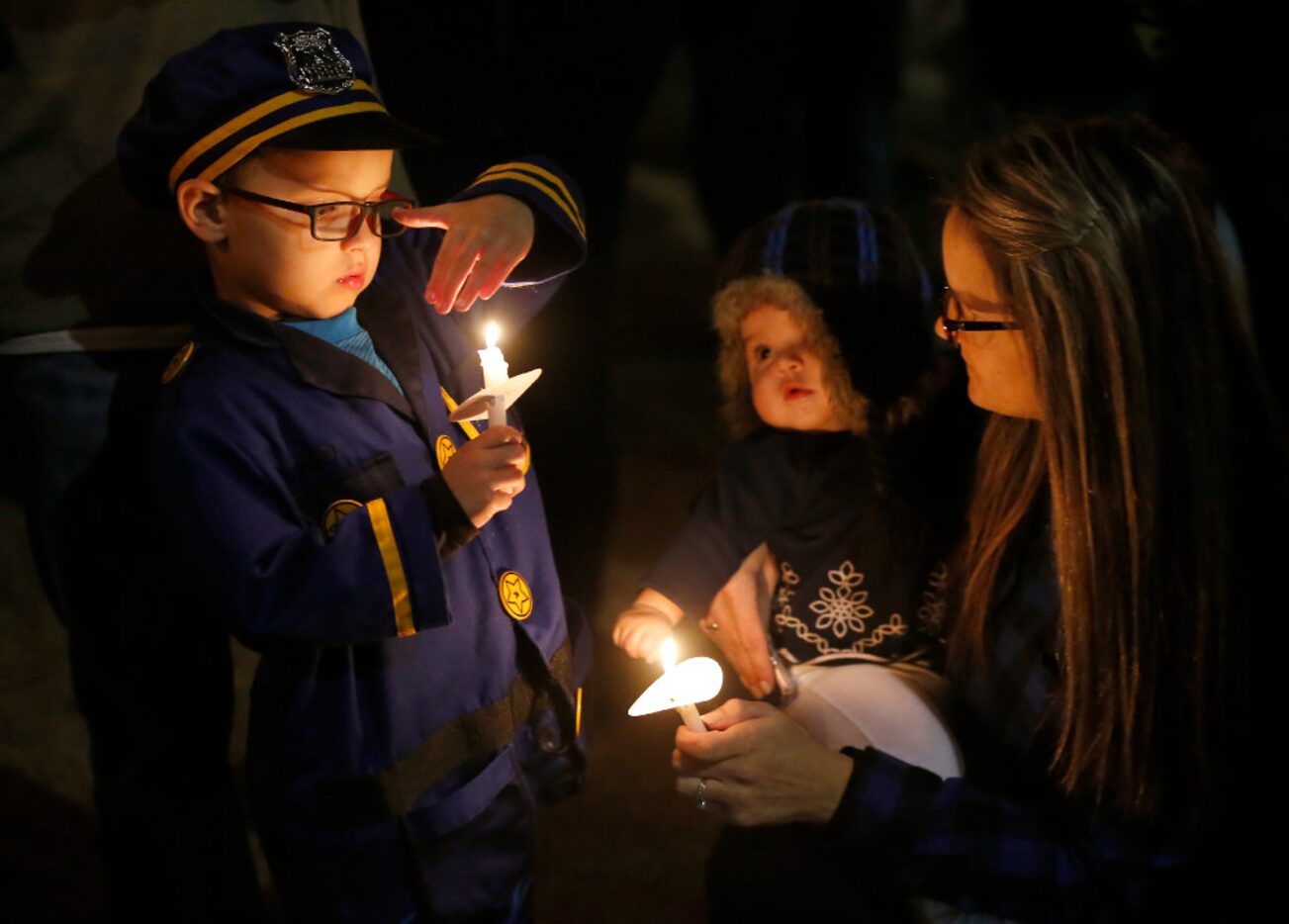 Kristen Garza (right) with her 7-month-old daughter Ally Garza (center) and 4-year-old son...