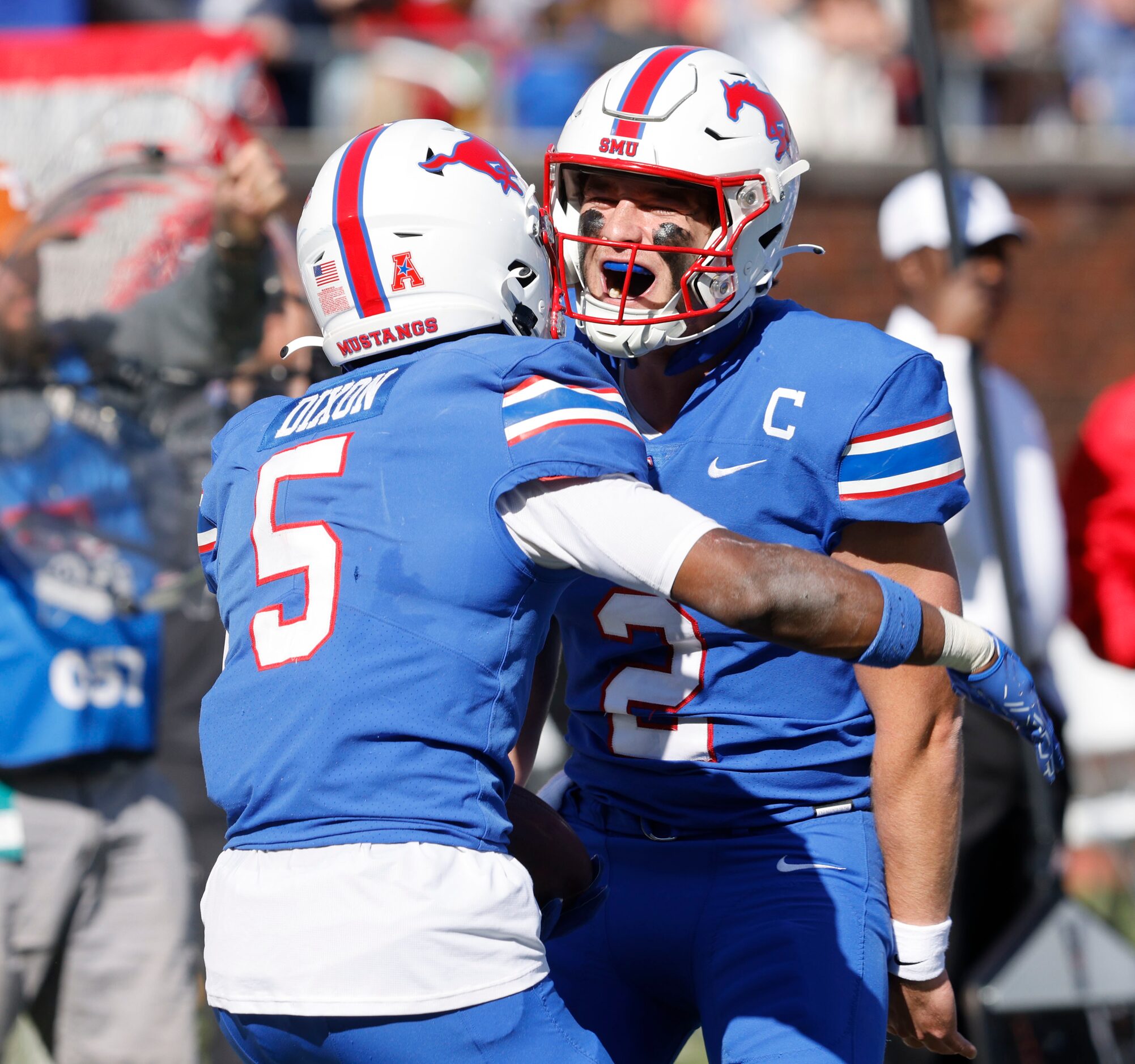 SMU wide receiver Moochie Dixon (5) celebrates with SMU quarterback Preston Stone (2) after...