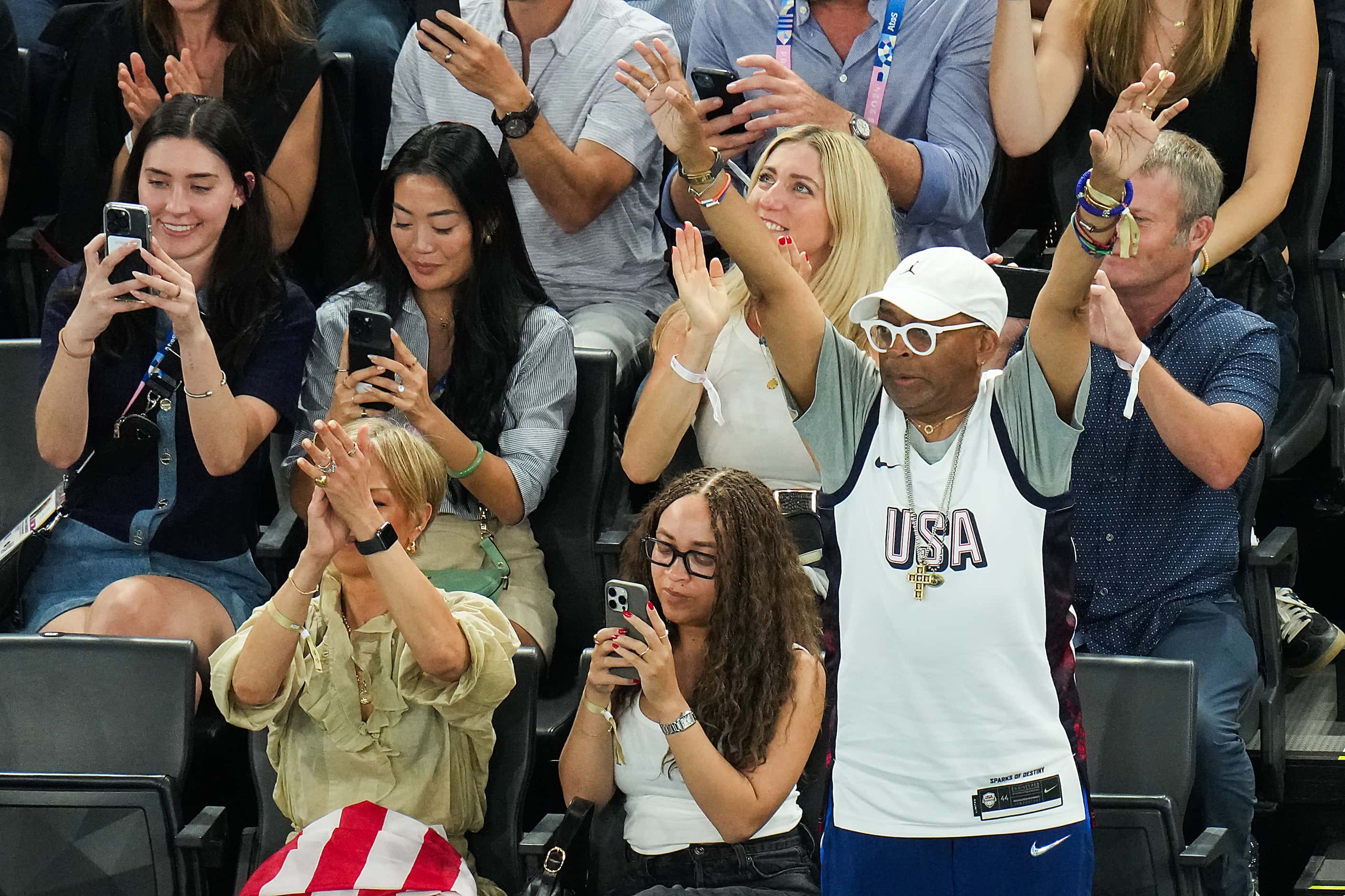 Film director Spike Lee cheers on Team USA during the women’s gymnastics team final at the...