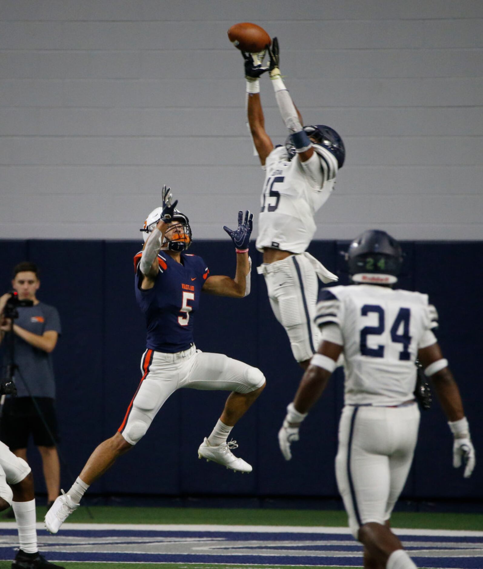 Frisco Lone Star's Toren Pittman (15) intercepts a pass intended for Frisco Wakeland's Kevin...